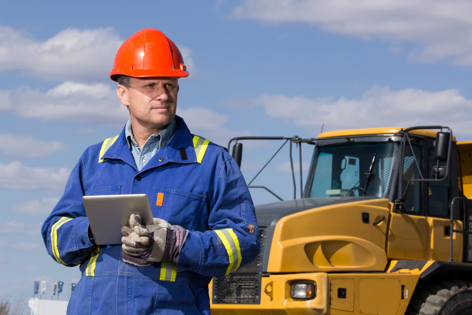 Dump Truck Driver and Tablet Computer